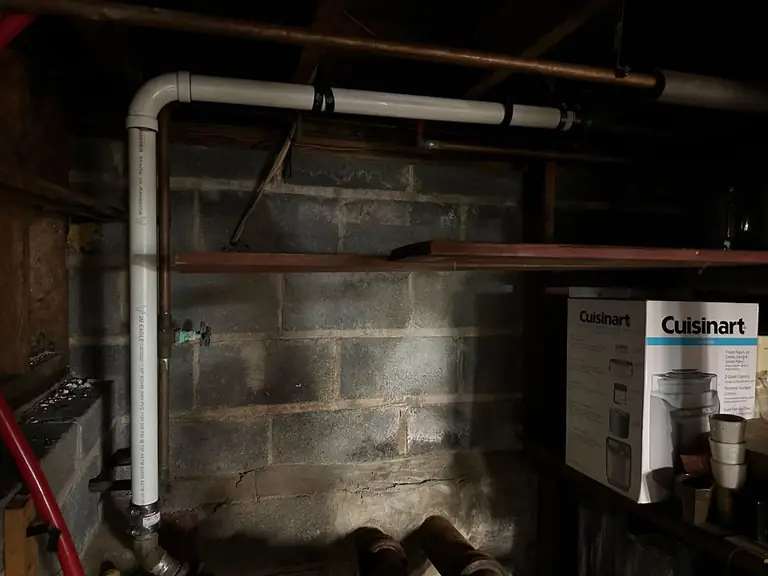 New drain pipe installed along a basement wall — Lumin Drain NJ