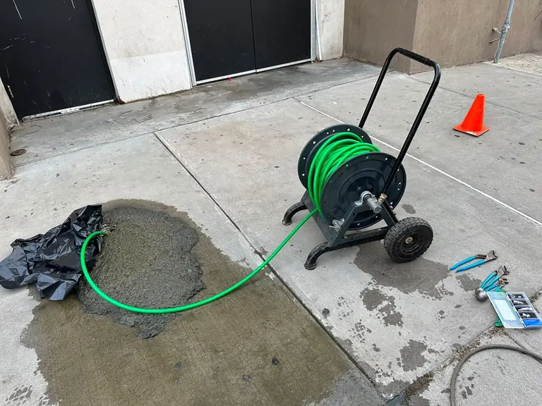 Hydro jetting cart, high-pressure hose and nozzle set at an exterior sewer cleanout — hydro jetting in Millstone Township, NJ