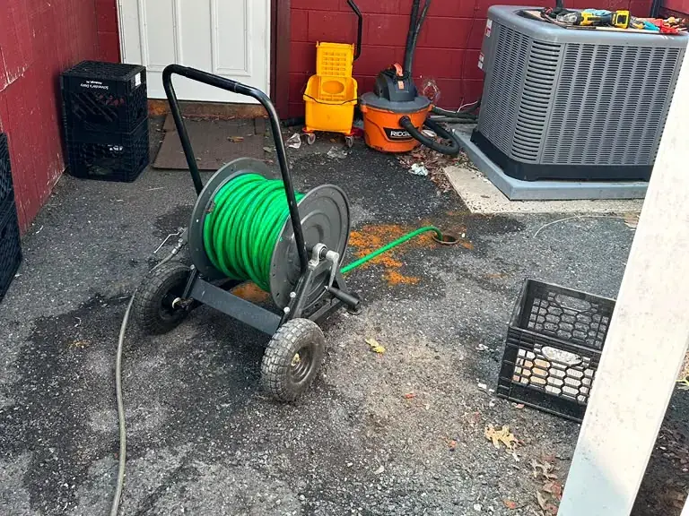 Hydro jetting machine clearing an exterior drain line at a commercial building — hydro jetting in Delaware Township, NJ