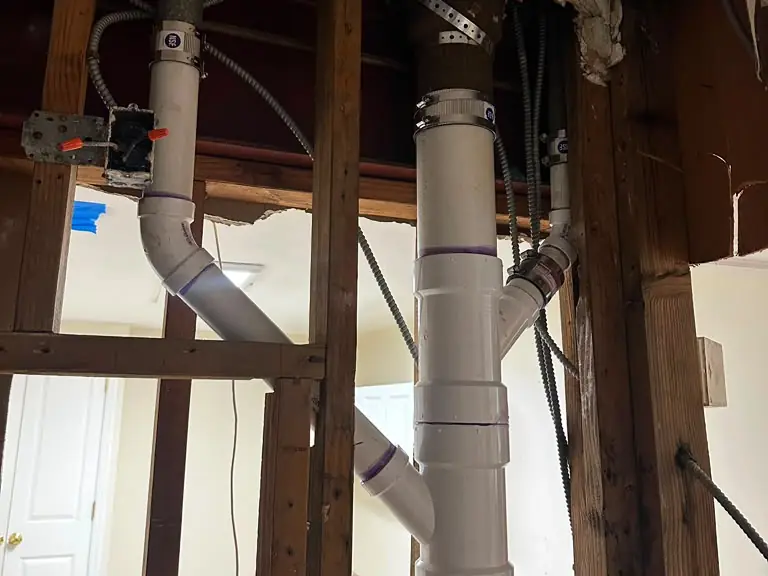 Leaking in-wall drain and vent lines replaced with new PVC piping inside the framing — leak detection and repair in Mannington, NJ