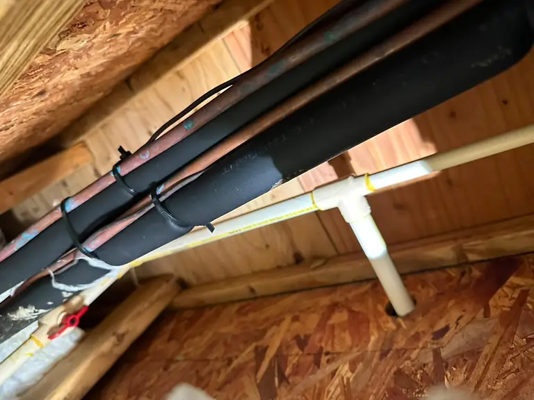 Repaired and insulated water lines with a new supply line run through the floor joists — broken pipe repair in New Jersey