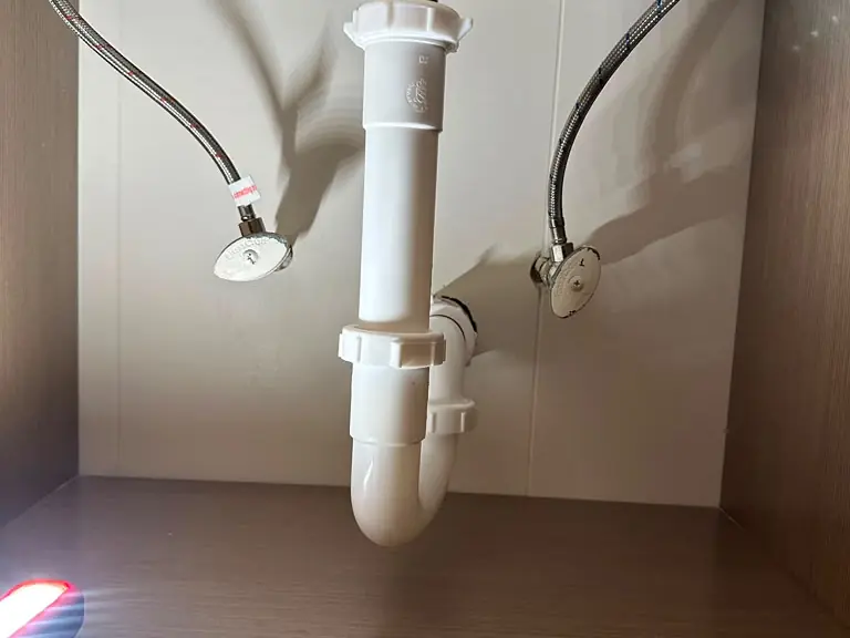 New sink drain assembly and braided supply lines installed after a leak repair — leak detection and repair in Nutley, NJ
