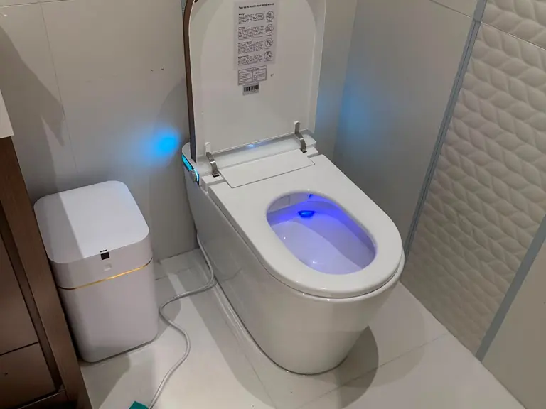 Smart bidet toilet with heated seat and LED bowl light professionally installed — toilet installation and repair in Central New Jersey