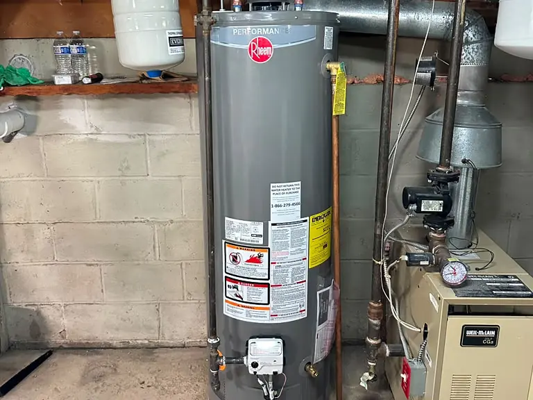 Replacement gas water heater installed beside the boiler with new expansion tank and piping — water heater installation and repair in Bound Brook, NJ
